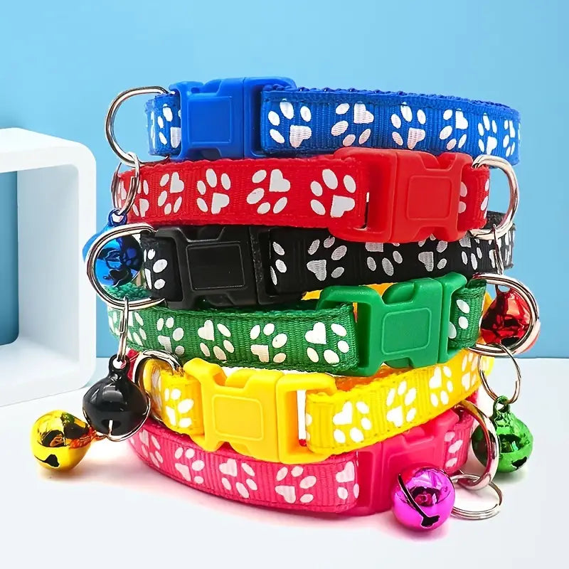 ed0c2e1e75f930c0d1e22a8dab406cde.jpg Adjustable Cat Bell Collar with Paw Print Design - Image 1